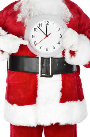 Hands of Christmas  Santa with a clockの写真素材