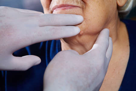 Doctor examining senior woman patient. Health careの写真素材