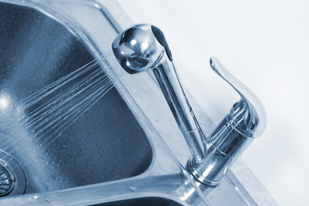Kitchen Water tap and sink. Renovation  and plumbing.の写真素材