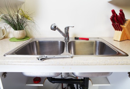 Kitchen Water tap and sink. Renovation  and plumbing.の写真素材