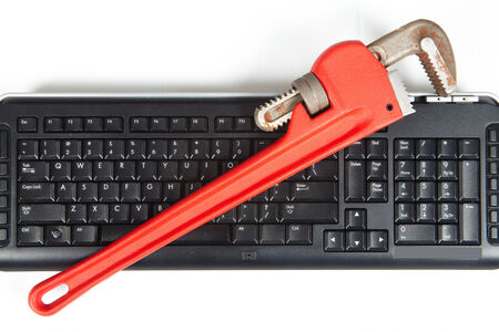 Construction and computer technology. Tools and keyboardの写真素材
