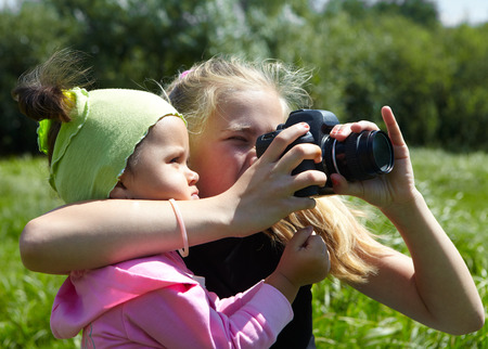 Young photographer and cameraの写真素材