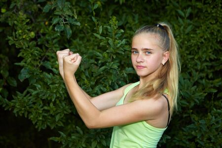 Young girl in the garden. Sport on the lawnの写真素材