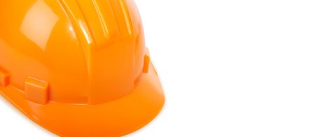 The orange helmet on a white background. Constructionの写真素材