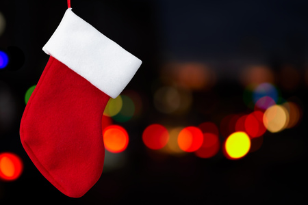 Red christmas sock and multi-colored lights. Christmasの写真素材