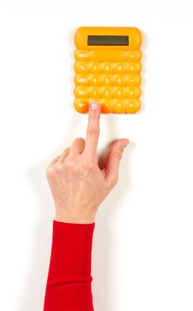 Hands in red jacket and yellow calculator on white background
