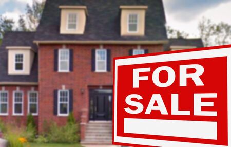 Home for sale. Sign in front of new homeの写真素材