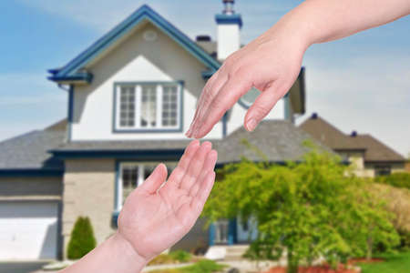 Home for sale. Sign in front of new homeの写真素材