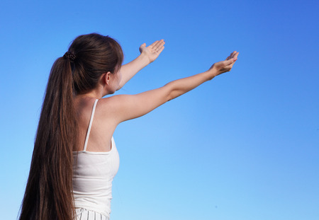 Young happy girl in the sunny morningの写真素材