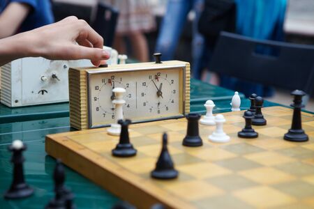 Chess tournament. Children play chess at the tableの写真素材
