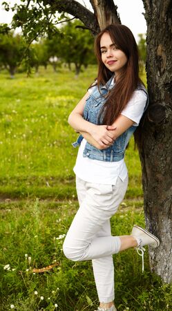 The girl in the sunny morning in a meadowの写真素材