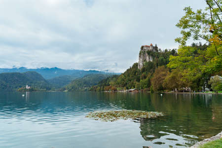 Lake bled with a castle in cloudy weather in summerのeditorial素材