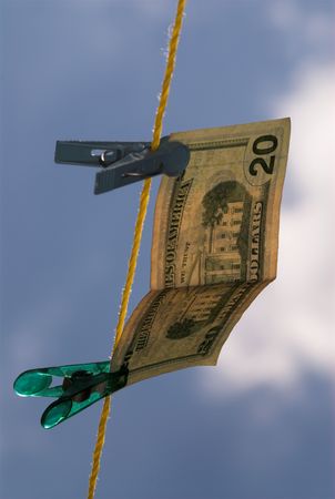 Money is hanging on clothes line in the airの写真素材