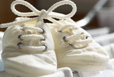 Closeup of funny bow on baby's bootees.の写真素材