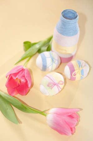 Pink tulips, Easter eggs and handmade yarn wrapped bottle