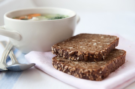 Closeup of healthy vegetable soup with wholemeal bread