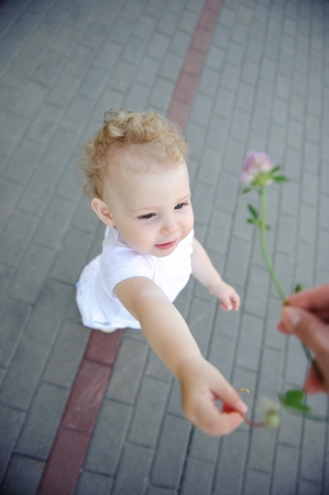 Cute funny little girl over pavement backgroundの写真素材
