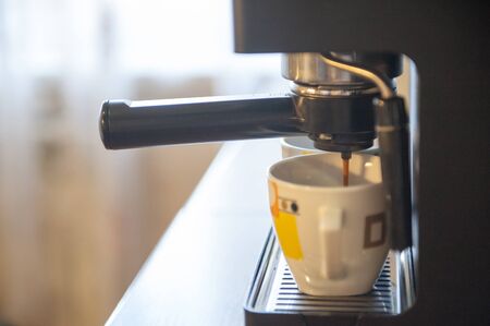 Coffee making using espresso machine at homeの写真素材