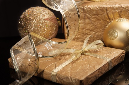 Golden set of Christmas decorations over deep dark backgroundの写真素材