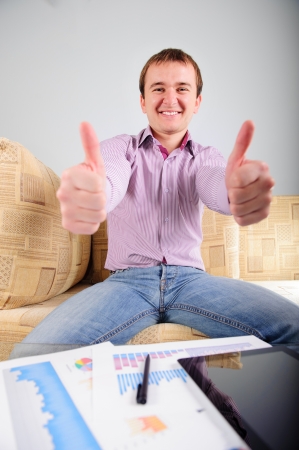 Young student is happy about his studyの写真素材