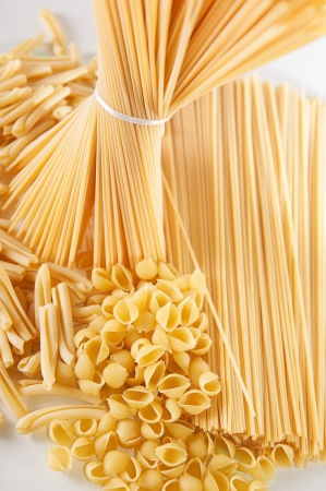 A bunch of wholegrain yellow spaghetti pastaの写真素材