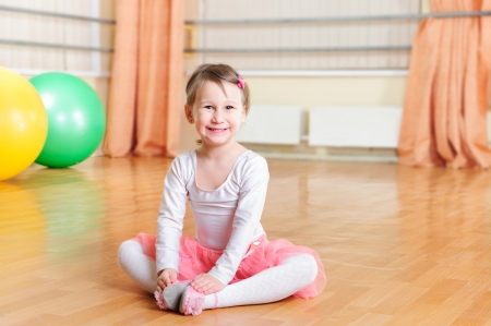Cute little ballerina training at ballet classの写真素材