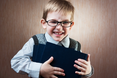 Portrait of cute little boy in tie and glassesの写真素材
