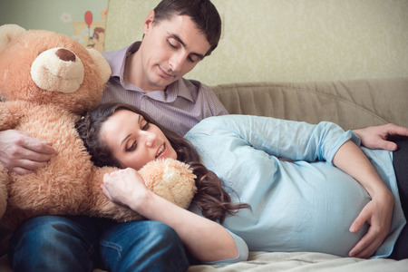 Happy young couple anticipating childs birthの写真素材