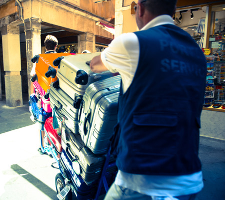 Porter service at narrow streets of Veniceの写真素材