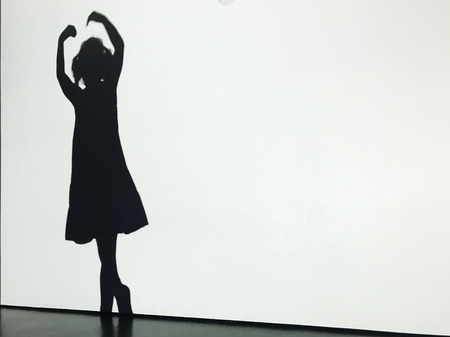 Dancing silhouette of a little girl at ballet lessonの写真素材