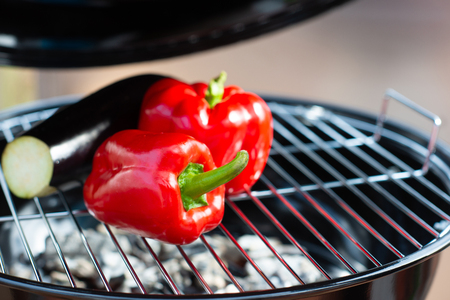 Close up of a grill with colorful vegetables at summer timeの写真素材