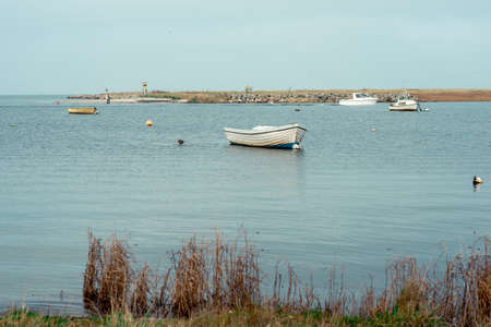 Photo of rural bucht with little boads in Baltic sea in north Germanyの写真素材