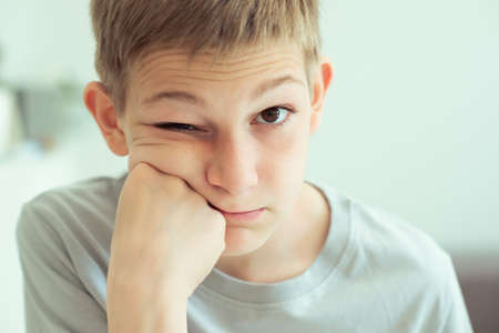 Closeup portrait of disappointed teen handsome boy