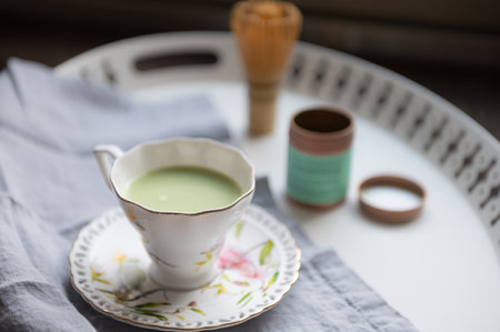 Closeup photo of cup of matcha. Green healthy japanese tee for detox