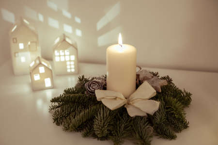 Christmas decoration with fir, candles, and magic lightsの写真素材