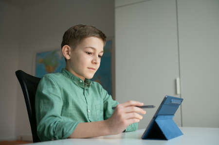 Online lesson during quarantine for teen male studentの写真素材