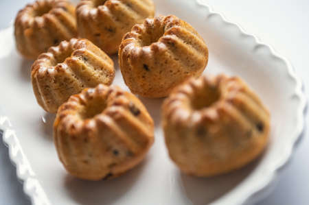 Tasty muffins on white nice plate on table at birthday partyの写真素材