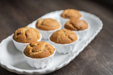 Appetizing muffins on beautiful white plateの写真素材