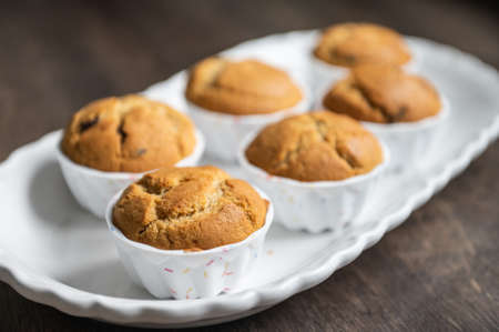 Appetizing muffins on beautiful white plateの写真素材