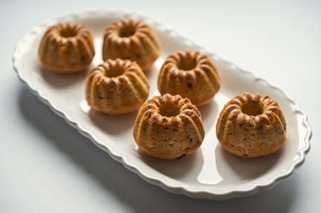 Homemade yummy muffins cakes on beautiful plateの写真素材
