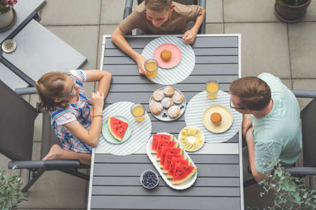Happy family having brunch outdoors. Top viewの写真素材