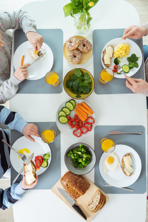 Family having healthy breakfast. Flatlay view from topの写真素材