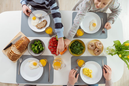 Family having healthy breakfast. Flatlay view from topの写真素材