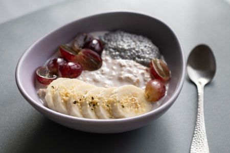 Healthy breakfast concept: cereal, grapes, banana, and chiaの写真素材