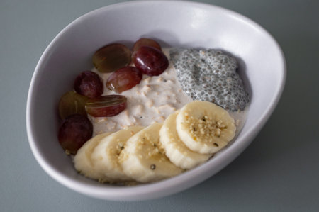 Healthy breakfast: cereal, grapes, banana, and chiaの写真素材