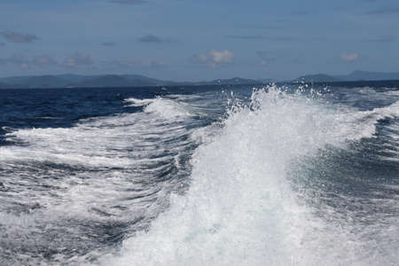 background waves and splashes, speedboat ride near tropical islands in ocean in asia