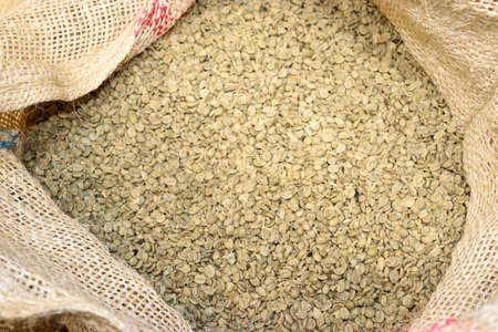 Roasted coffee, coffee factory, coffee roast in a machine in a factory