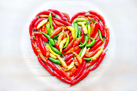 Hot spices, chili pepper aromatic ingredients on a white background, vitamins for the bodyの写真素材