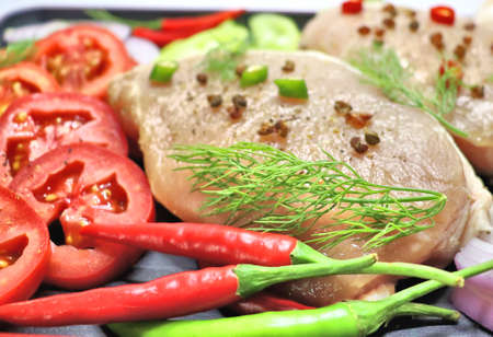 Meat with vegetables and spices, onions, red and green peppers, ginger, dill