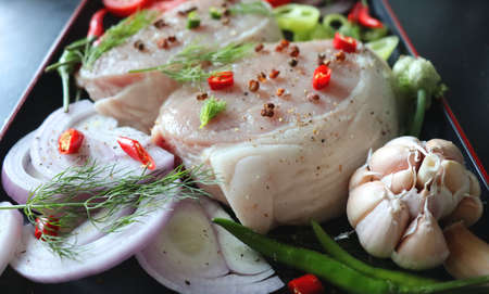 Meat with vegetables and spices, onions, red and green peppers, ginger, dill